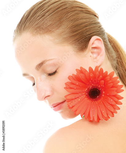 Photo: A beautiful young woman with a flower A beautiful young woman with a flower