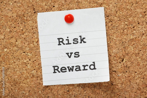 Photo: Risk Versus Reward Cork Notice board concept Risk Versus Reward Cork Notice board concept