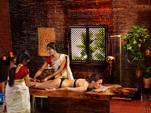 Photo: Woman having Ayurvedic spa treatment. Woman having Ayurvedic spa treatment.