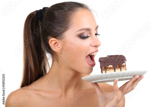 Photo: Portrait of beautiful young girl with chocolate cupcake Portrait of beautiful young girl with chocolate cupcake
