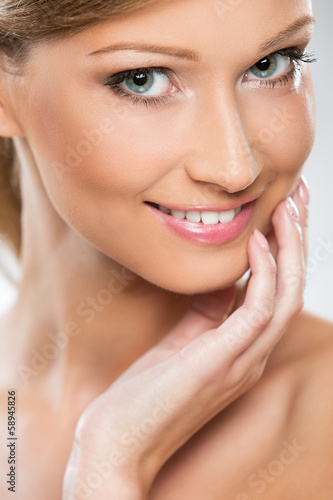 Photo: Natural looking woman enjoying her beauty Natural looking woman enjoying her beauty