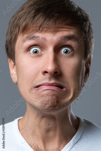 Photo: Funny guy with silly grimace Funny guy with silly grimace