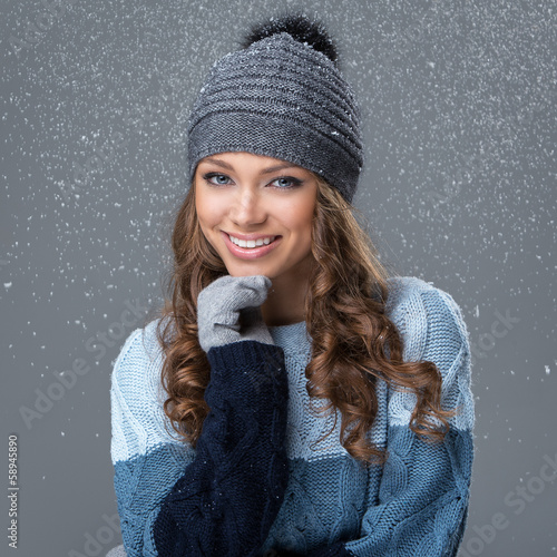 Photo: Cute girl in winter clothing with snowflakes Cute girl in winter clothing with snowflakes