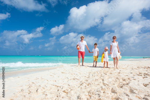 Photo: Family on a tropical beach vacation Family on a tropical beach vacation