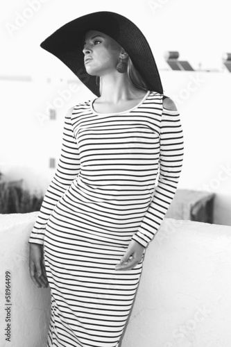 Photo: art portrait of beautiful woman in hat. monochrome.ladylike art portrait of beautiful woman in hat. monochrome.ladylike