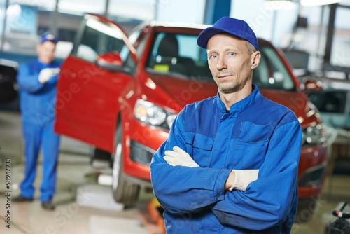 Photo: Repairman auto mechanic at workshop Repairman auto mechanic at workshop