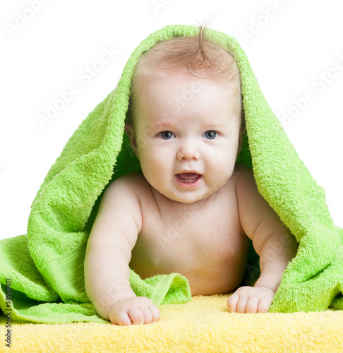 Photo: Cute happy baby in towels Cute happy baby in towels