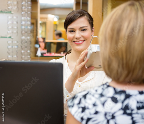 Photo: Optometrist Measuring Pupilary Distance Optometrist Measuring Pupilary Distance