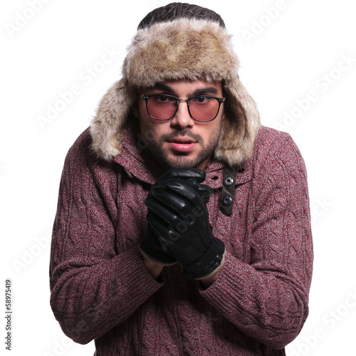 Photo: man rubbing his hands together to warm up man rubbing his hands together to warm up
