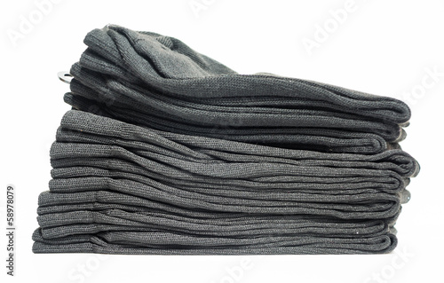 Photo: Tidy grey clothes with White Background Tidy grey clothes with White Background