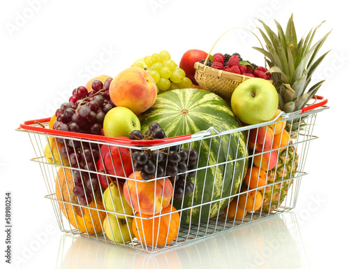 Photo: Assortment of exotic fruits in metal basket isolated on white Assortment of exotic fruits in metal basket isolated on white