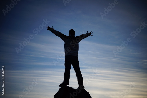 Photo: Man on top of mountain Man on top of mountain