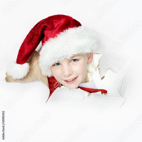 Photo: Santa Claus looking through paper hole Santa Claus looking through paper hole