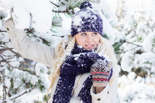 Photo: beautiful winter woman playing with snow beautiful winter woman playing with snow