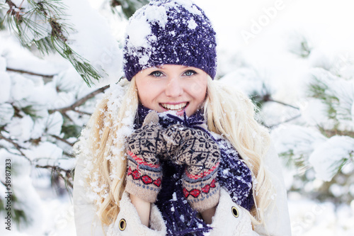 Photo: beautiful winter woman playing with snow beautiful winter woman playing with snow