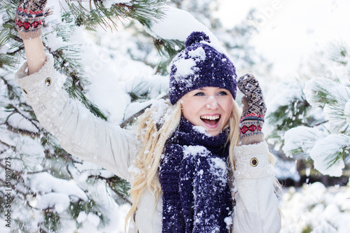 Photo: beautiful winter woman playing with snow beautiful winter woman playing with snow