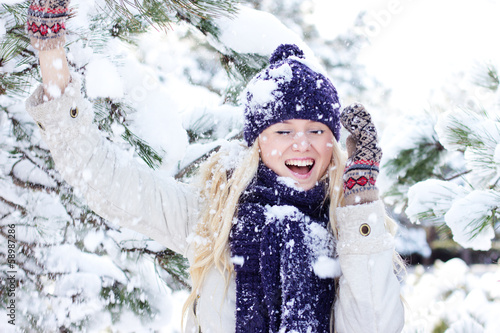 Photo: beautiful winter woman playing with snow beautiful winter woman playing with snow