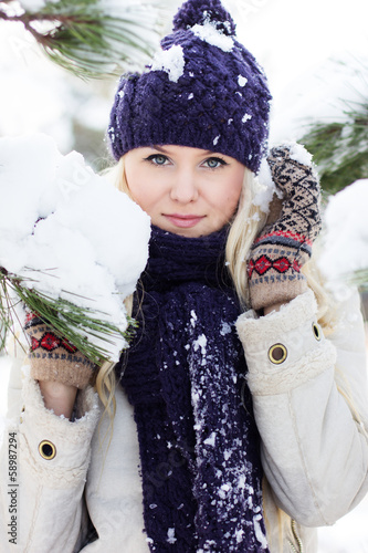 Photo: beautiful winter woman playing with snow beautiful winter woman playing with snow