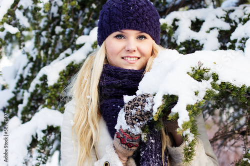 Photo: beautiful winter woman playing with snow beautiful winter woman playing with snow