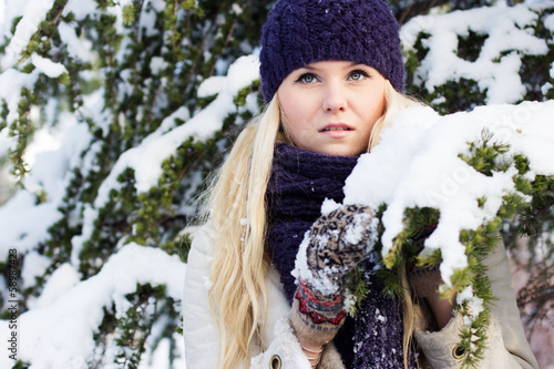 Photo: beautiful winter woman playing with snow beautiful winter woman playing with snow