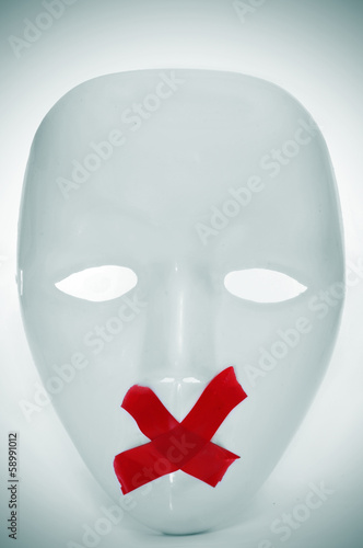 Photo: mask with its mouth shut with red tape mask with its mouth shut with red tape