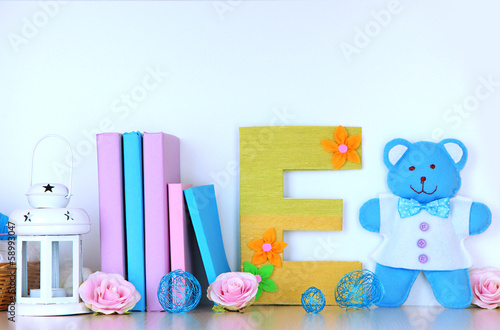 Photo: Shelf decorated with handmade knit letter Shelf decorated with handmade knit letter