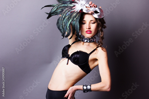 Photo: Sexy young woman in lingerie with mask Sexy young woman in lingerie with mask