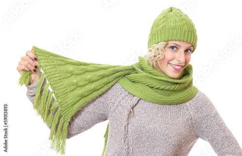 Photo: Smiling female playing with her scarf, isolated on white Smiling female playing with her scarf, isolated on white