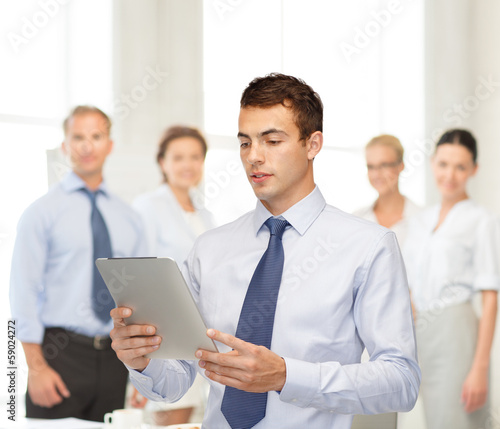 Photo: buisnessman with tablet pc buisnessman with tablet pc