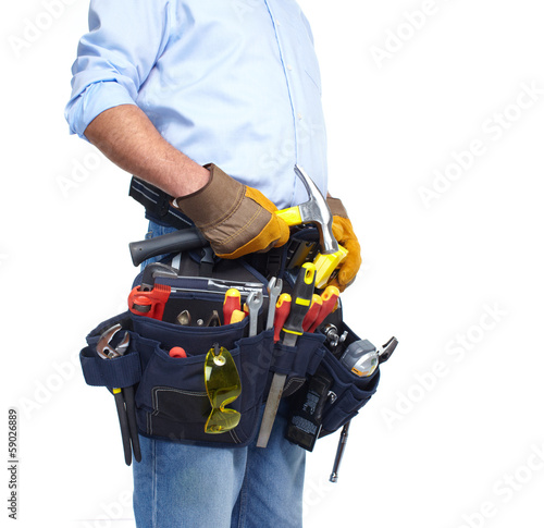 Photo: Worker with a tool belt. Worker with a tool belt.