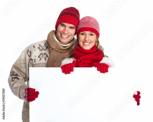 Photo: Happy couple with placard. Happy couple with placard.