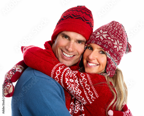 Photo: Happy christmas couple in winter clothing. Happy christmas couple in winter clothing.