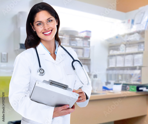 Photo: Pharmacist woman. Pharmacist woman.