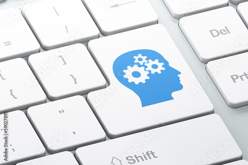 Illustration: Education concept: Head With Gears on keyboard background Education concept: Head With Gears on keyboard background