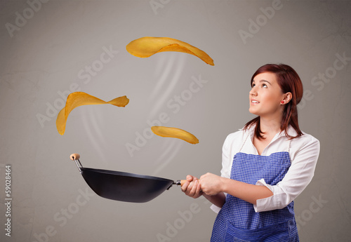 Photo: Woman making pancakes Woman making pancakes
