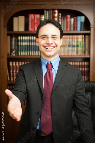 Photo: Businessman giving an handshake Businessman giving an handshake