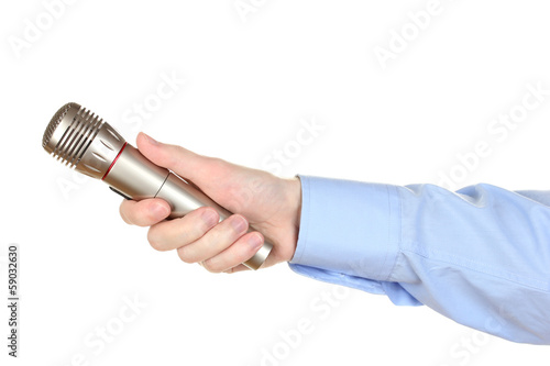 Photo: Male hand with microphone isolated on white Male hand with microphone isolated on white