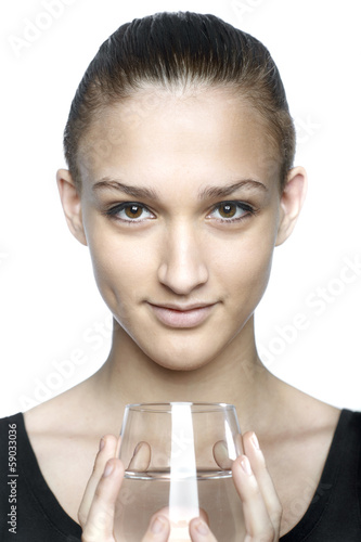 Photo: Young woman with glass of water Young woman with glass of water
