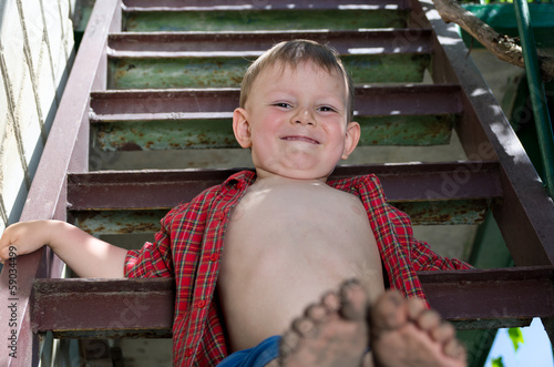 Photo: Little boy showing off his dirty feet Little boy showing off his dirty feet