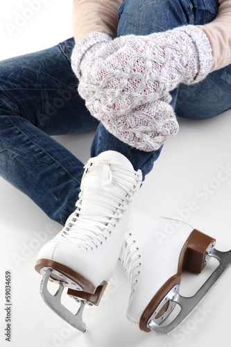 Photo: Skater wearing skates isolated on white Skater wearing skates isolated on white