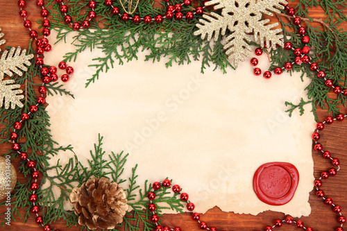 Photo: Frame with vintage paper and Christmas decorations Frame with vintage paper and Christmas decorations