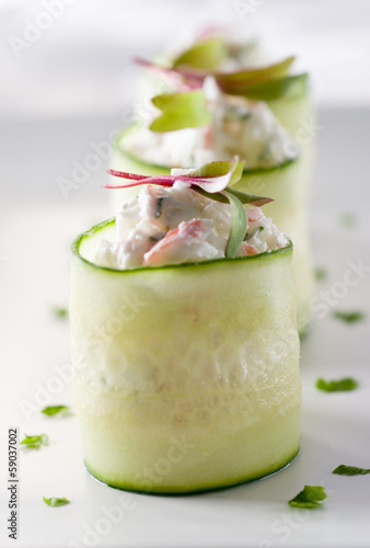 Photo: crab Salad appetizers in cucumber bowls. crab Salad appetizers in cucumber bowls.
