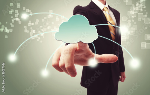 Photo: Businessman pushing cloud icon Businessman pushing cloud icon