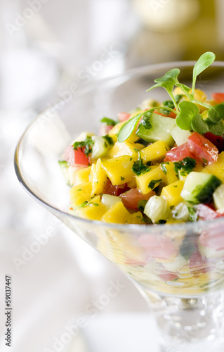 Photo: fruit and vegetable salad appetizer closeup. fruit and vegetable salad appetizer closeup.