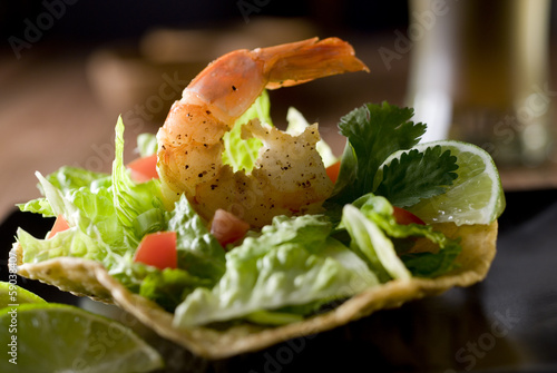 Photo: tostada with vegetables and shrimp. tostada with vegetables and shrimp.
