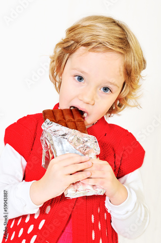 Photo: girl eating chocolate girl eating chocolate