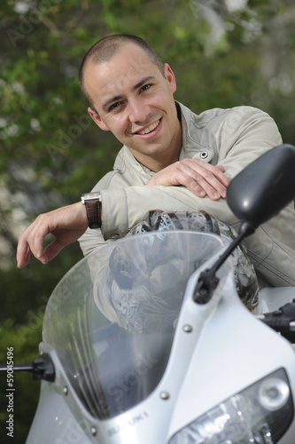 Photo: Young man with motorcycle Young man with motorcycle