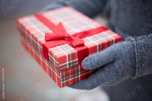 Photo: Giftbox in hands Giftbox in hands