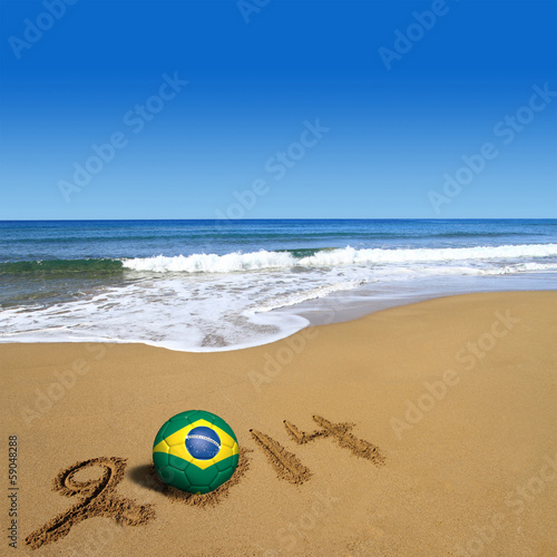 Photo: Soccer ball with Brazilian flag and 2014 on beach Soccer ball with Brazilian flag and 2014 on beach