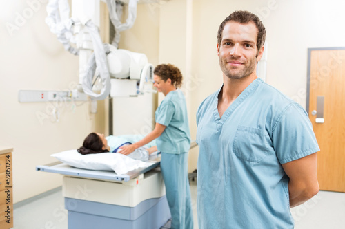 Photo: Nurse With Colleague Preparing Patient For Xray Nurse With Colleague Preparing Patient For Xray